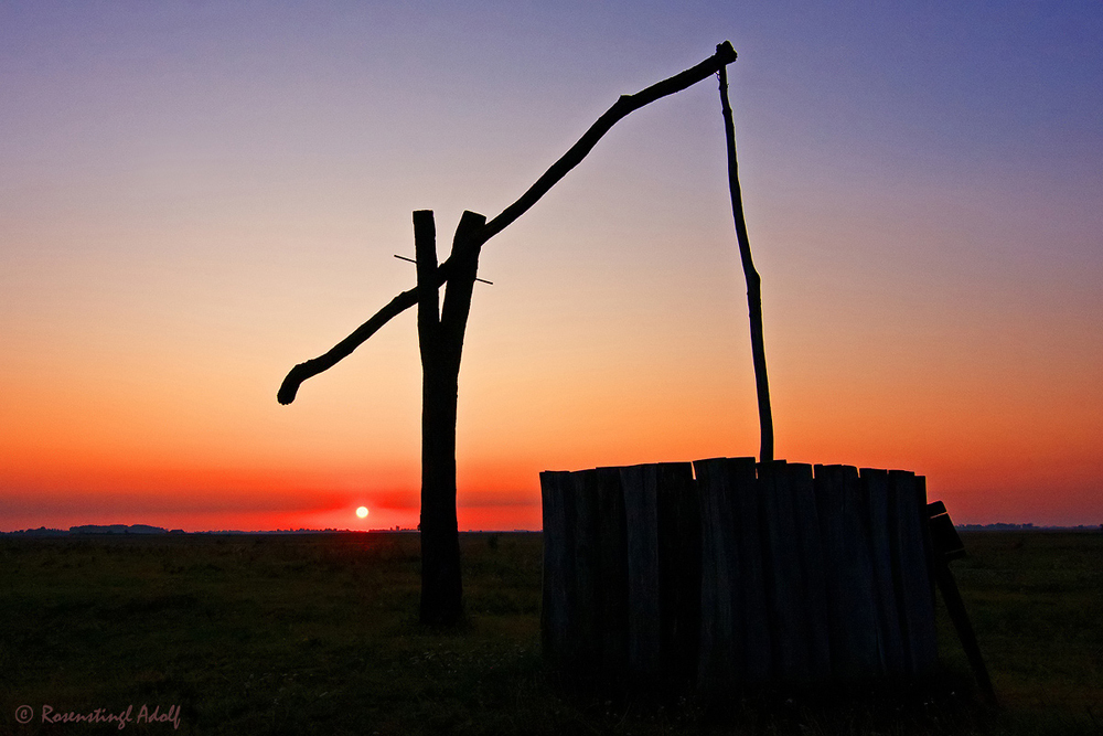 "Sonnenaufgang mit Ziehbrunnen"