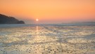 Sonnenuntergang am gefrorenen Wallersee