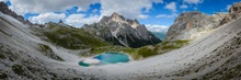 Berge Wolken See und viel Schotter